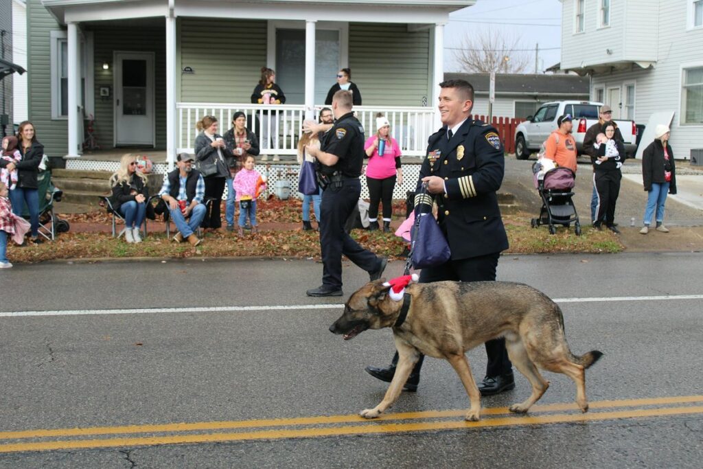 Close-up of an adult male's hands in handcuffs, symbolizing law enforcement and justice.