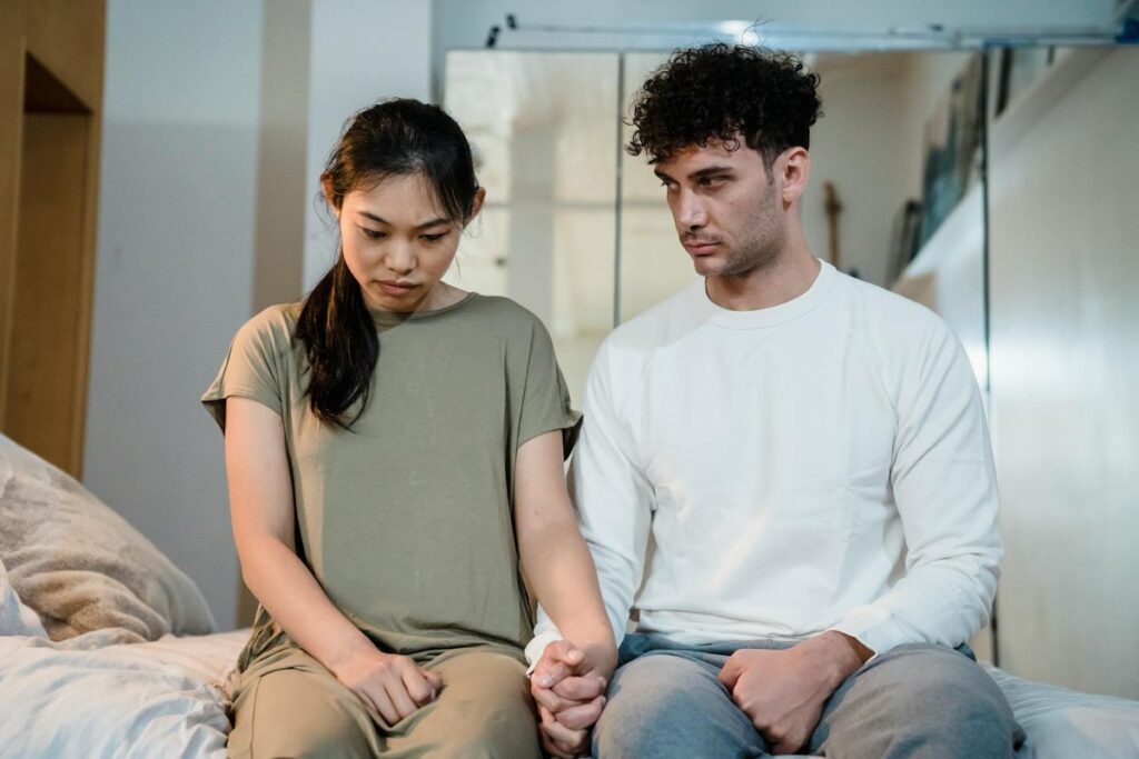 Close-up of a bronze Lady Justice statue holding scales in an office environment.