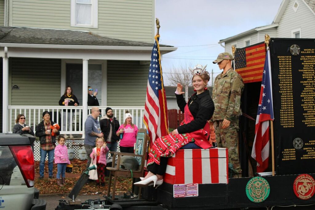 A tense interrogation scene inside a prison room with an inmate and detective.