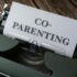 Close-up of a typewriter with a co-parenting document, symbolizing effective collaboration.