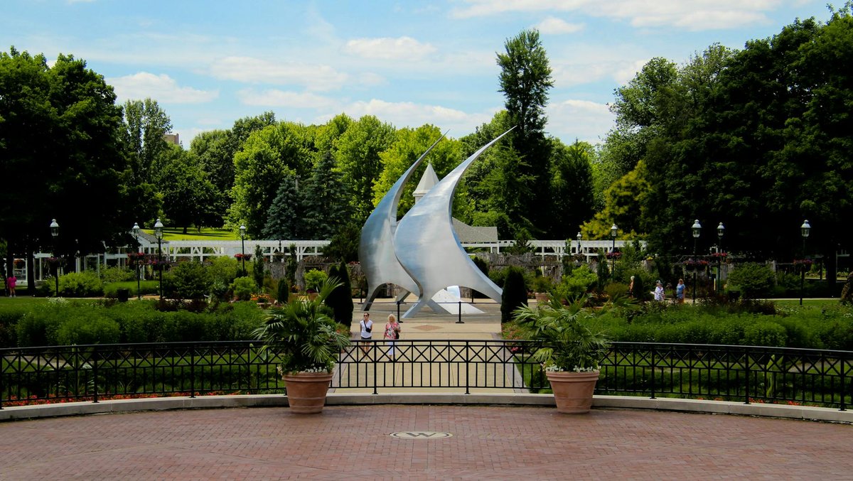 Scenic view of NavStar Sculpture in Franklin Park with lush greenery. Captured in summer.