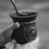 Close-up of hands holding a gourd with mate tea in Porto Alegre, Brazil.