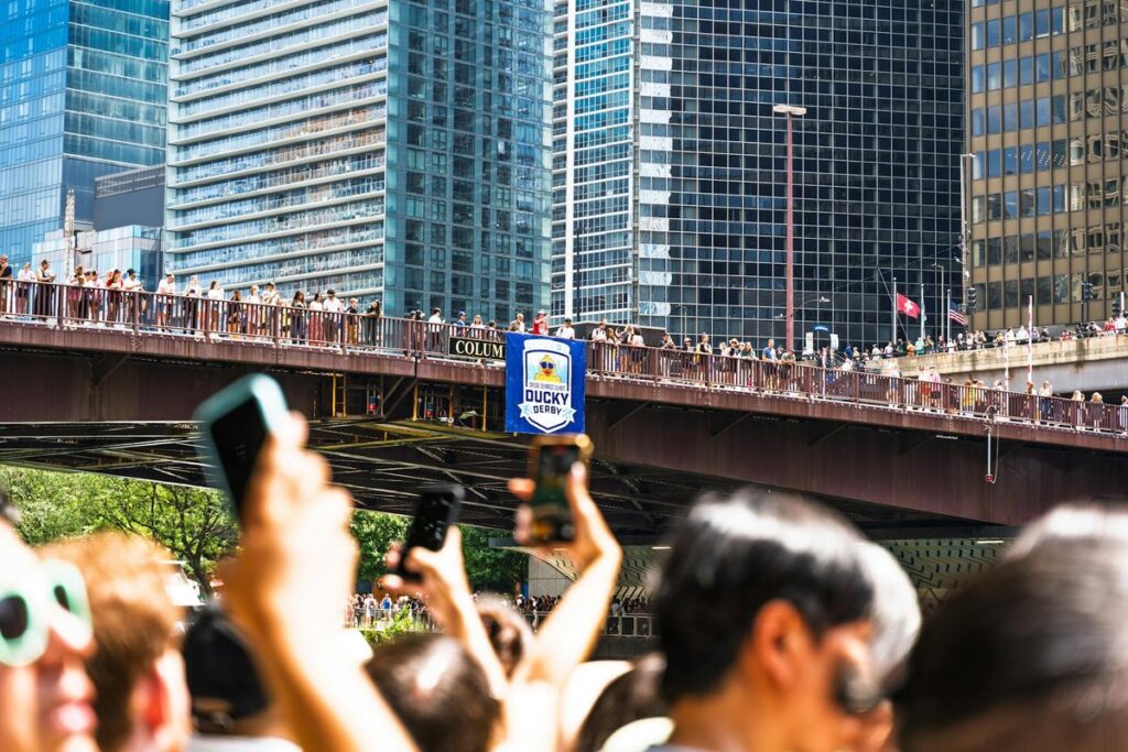 Crowd gathers for the annual rubber duck race on Columbus Bridge in Chicago.