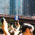 Crowd gathers for the annual rubber duck race on Columbus Bridge in Chicago.