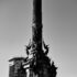 Black and white photo of Columbus Monument in Barcelona highlighting its intricate details.